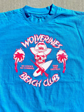 Load image into Gallery viewer, Bright Blue Tee, with large front screened No Kooks, No Commies Beach Club Jolly Roger design.
