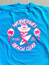 Load image into Gallery viewer, Bright Blue Wolverines Tee, No Kooks, No Commies Beach Club Jolly Roger design.
